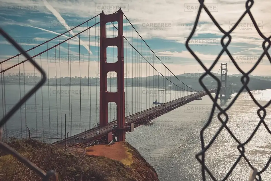Portrait of Golden Gate Bridge Through Chain Link Fence, Sausalito, California · United States