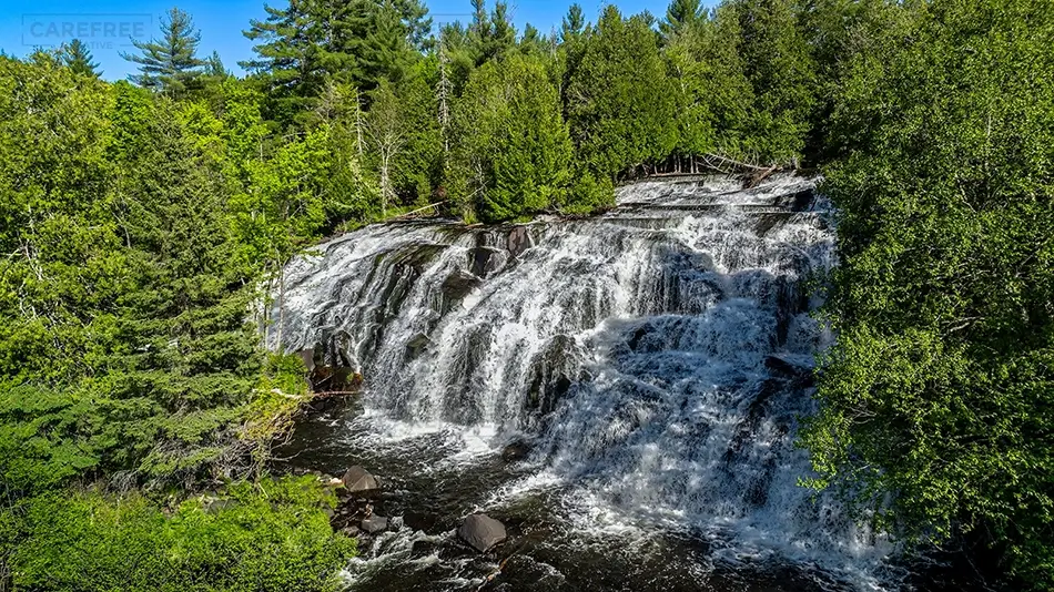 Bond Falls State Park Cascading Waterfall Through Forest, Trout Creek, Michigan · United States