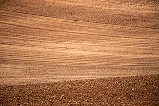 Canyon of the Ancient National Monuments Plowed Brown Soil Texture Field, Cortez, Colorado