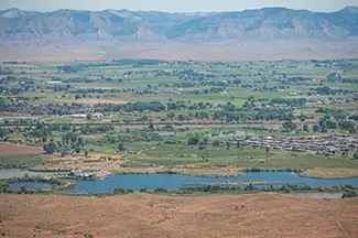 Colorado National Monument Lush Valley Below Arid Hills