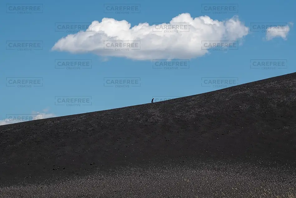 Craters Of The Moon Hiker On Volcanic Slope, Arco, Idaho · United States