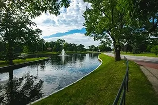 Deering Oaks Park Reflective Waterway Flanked by Trees, Portland, Maine