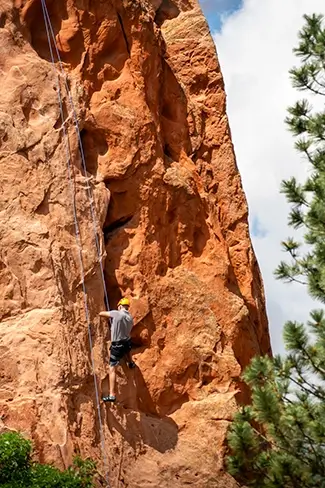 Garden of the Gods Rock Climber Ascending Cliff, Colorado Springs, Colorado