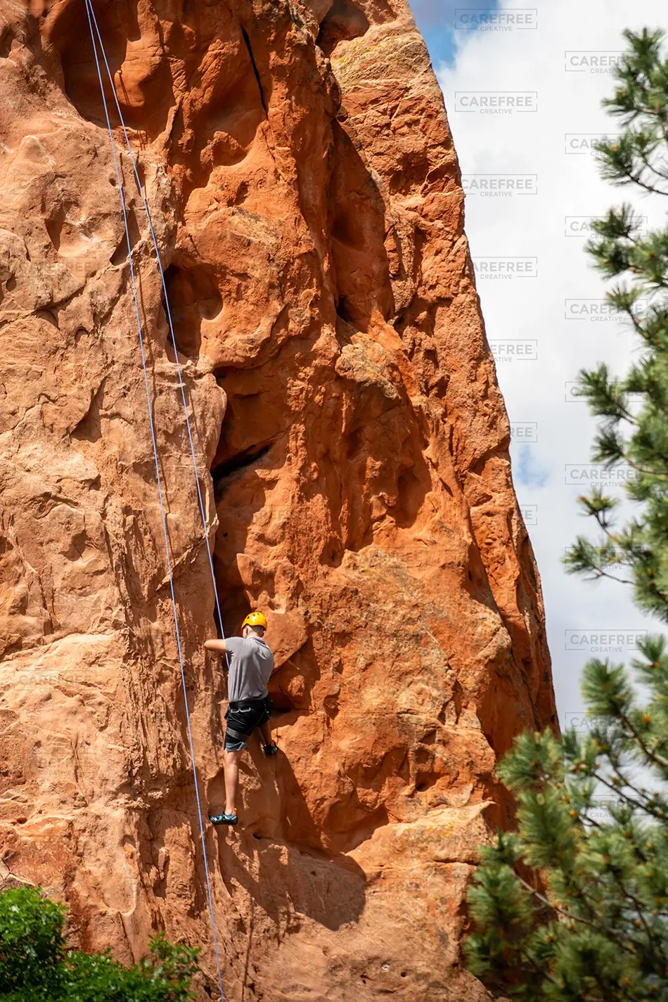 Garden of the Gods Rock Climber Ascending Cliff, Colorado Springs, Colorado · United States