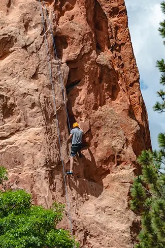 Garden of the Gods Rock Climber Scaling Cliff, Colorado Springs, Colorado