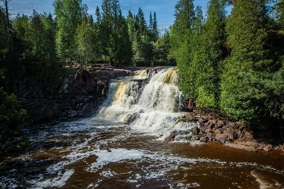Gooseberry Falls Waterfall Cascading Down Rocks, Two Harbors, Minnesota · United States