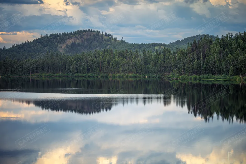 Kootenai Falls Suspension Bridge Forested Lake Reflection, Libby, Montana · United States