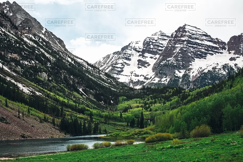 Maroon Bells Snowcapped Peaks and Green Valley, Aspen, Colorado · United States