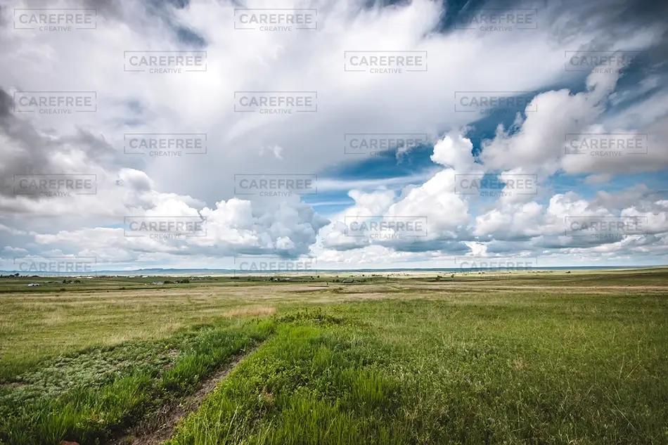 Paint Mines Interpretive Park Expansive Green Landscape and Clouds, Calhan, Colorado · United States