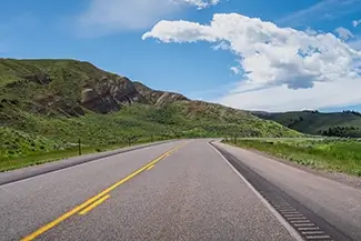 Wyoming Scenic Road Curving Through Green Hills, Wyoming