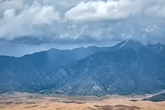 Zapata Falls Majestic Mountains Under Cloudy Sky, Alamosa, Colorado