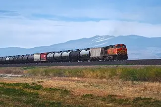 California Orange Locomotive Pulling Tankers