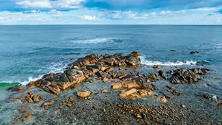 Fortunes Rock Beach Rocky Coastline and Calm Waters